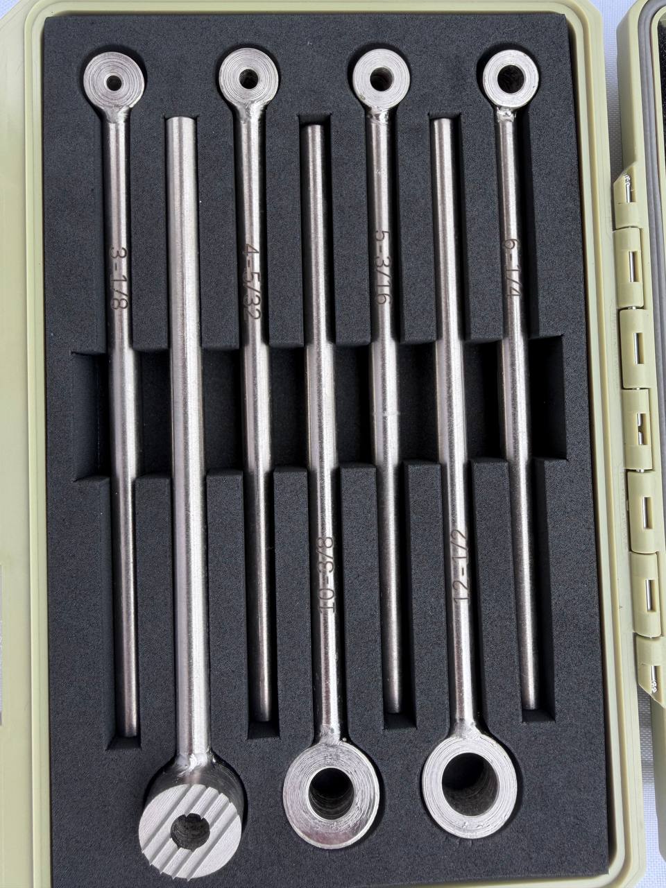 Seven Koolands RST331 low-clearance rivet nut setters arranged in a fitted storage case.